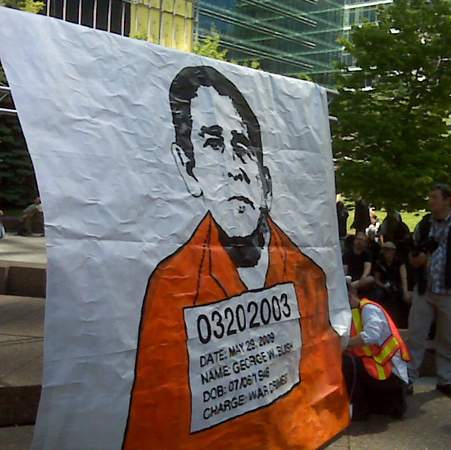 Toronto protesters throw shoes at Bush photo - image