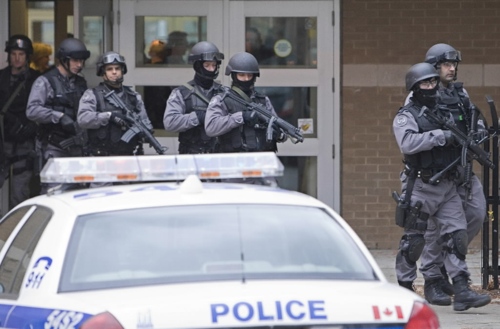 Police swarm Don Mills school after girl, 15, threatened with death - image