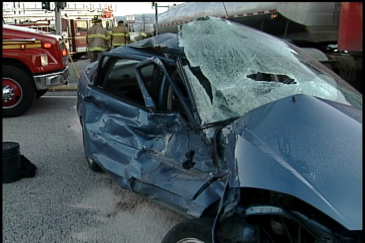 Car vs. tanker truck - image