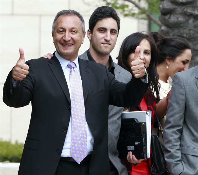 MGA chief executive Isaac Larian, left, celebrates a victory over Mattel Inc. outside of federal court in Santa Ana, Calif. on Thursday, April 21, 2011. Mattel alleged that Bratz designer Carter Bryant created the billion-dollar Bratz line while employed by Mattel and therefore own the doll line. MGA denied those claims and counter-sued. (AP Photo/Christine Cotter).