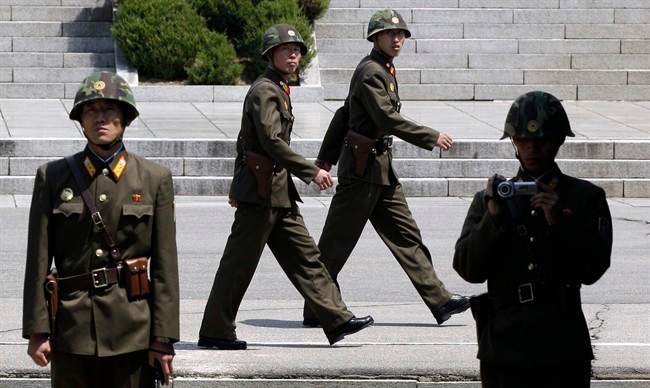 North Korean soldiers march to guard at the border village of the Panmunjom (DMZ) that separates the two Koreas since the Korean War, in Paju, north of Seoul, South Korea, Sunday, April 24, 2011.