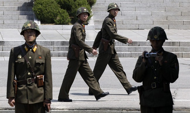 North Korean soldiers march to guard at the border village of the Panmunjom (DMZ) that separates the two Koreas since the Korean War, in Paju, north of Seoul, South Korea, Sunday, April 24, 2011.