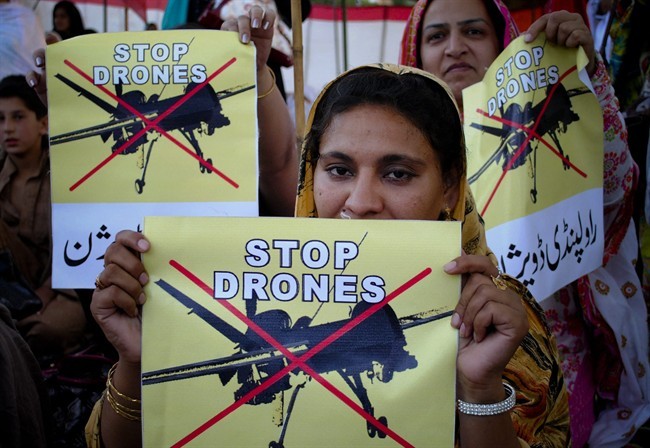 A woman supporter of Pakistan Tehreek-e-Insaf or Movement of Justice, takes part in a rally against the U.S. drone strikes in Pakistani tribal areas. The Obama administration acknowledged publicly for the first time Wednesday that four American citizens have been killed in drone strikes since 2009 in Pakistan and Yemen. (AP Photo/Mohammad Sajjad).
