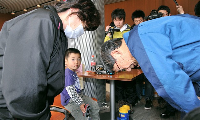 Tokyo Electric Power Co. President Masataka Shimizu, right, bows in apology Friday, April 22, 2011 to one of evacuees at a relocation center in Koriyama for people from the radiation evacuation zone in Fukushima Prefecture. Shimizu of TEPCO., the operator of the tsunami-stricken Fukushima Dai-ichi nuclear power plant, was received harshly when he toured the shelter of 1,600 people. (AP Photo/Kyodo News) JAPAN OUT, MANDATORY CREDIT, NO LICENSING IN CHINA, HONG KONG, JAPAN, SOUTH KOREA AND FRANCE.