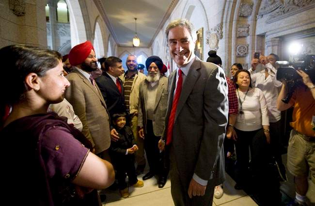 Outgoing Liberal leader Michael Ignatieff is greeted as he arrives for his first caucus meetings following the federal election in Ottawa, Wednesday May 11, 2011. THE CANADIAN PRESS/Sean Kilpatrick.
