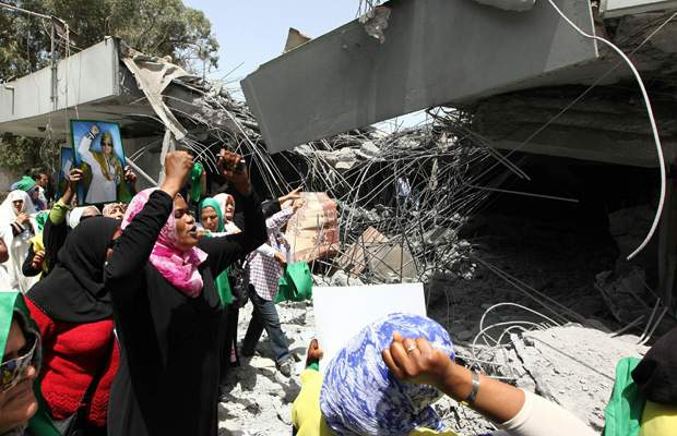 Angry mobs burn foreign embassies in Libya after NATO bombing kills Gadhafi son - image