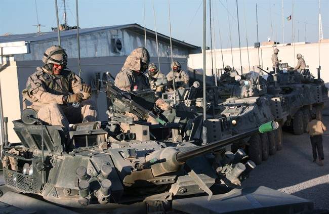 Canadian soldiers are seen on their LAV-IIIs at the Panjwaii District Centre, Afghanistan, on Monday, April 18, 2011. Hundreds of vehicles are among thousands of tonnes of equipment needing to be shipped back to Canada this year as the Afghan mission closes. THE CANADIAN PRESS/Colin Perkel.