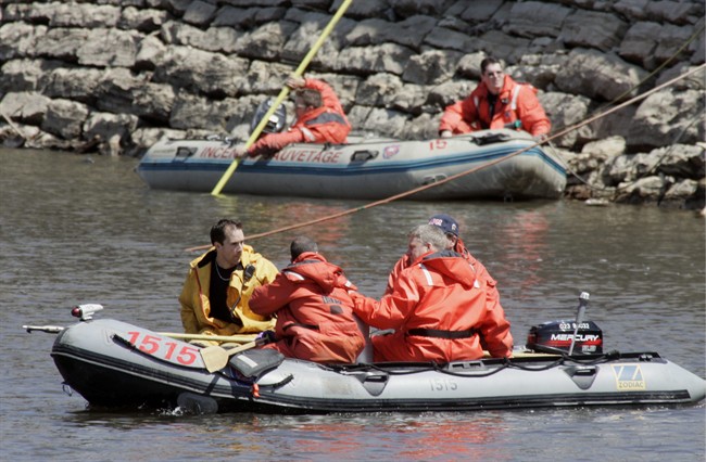 Police search the waters of the Lachine Canal in Montreal Thursday, May 5, 2005, looking for the body of Jolene Riendeau. Montreal police say they have found the remains of a girl who disappeared more than 12 years ago. THE CANADIAN PRESS/ Paul Chiasson.