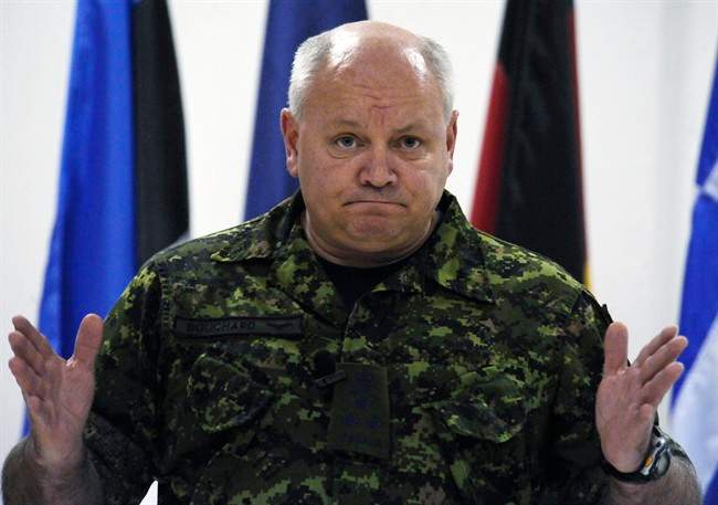 Canadian Lt. Gen. Charles Bouchard, NATO commander of the international military operation in Libya, gestures as he meets journalists at NATO headquarters, in Bagnoli, Naples, Italy, Tuesday, April 26, 2011. The Canadian general commanding the NATO campaign against Libya says the alliance is appealing to Moammar Gadhafi's troops to stop using human shields. THE CANADIAN PRESS/AP-Salvatore Laporta.