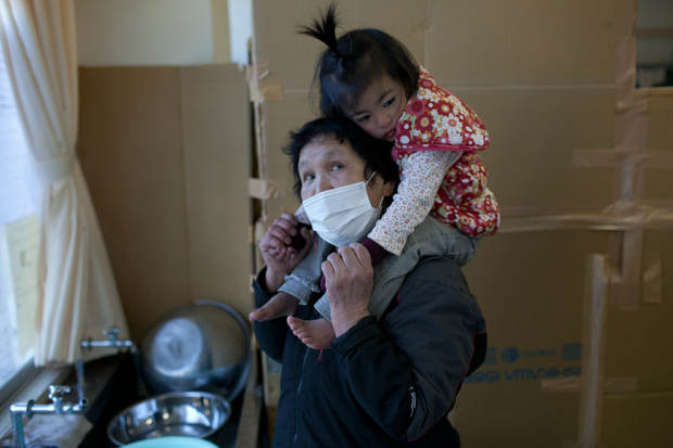 Japanese in expanded evac zone leave homes - image