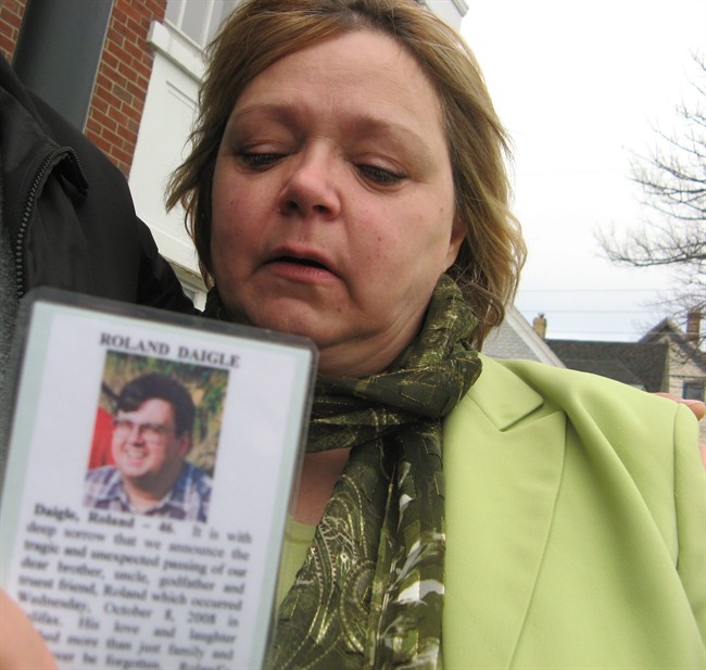 Lynda MacDonald holds a photo of her brother, Roland Daigle, in Windsor, N.S., Monday, May 2, 2011. Daigle died on Oct. 8, 2008 after exposure to a toxic chemical, trimethylsilyl diazomethane. The pharmaceutical firm where he worked, Sepracor Canada, has pleaded guilty to failing to ensure adequate venting in the death. Four other safety charges were dropped. THE CANADIAN PRESS/Michael Tutton.