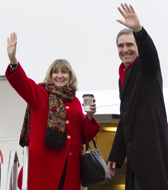 Liberal leader Michael Ignatieff and his wife Zsuzsanna Zsohar wave as they board their campaign plane at Toronto airport Wednesday, April 20, 2011. THE CANADIAN PRESS/Jonathan Hayward.