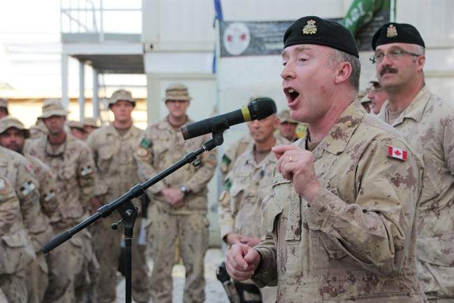 Chief of Land Staff, Lt.-Gen. Peter Devlin, addresses Canadian soldiers at Kandahar Airfield, Afghanistan, on Wednesday May 11, 2011. Devlin said the Canadian flag has never flown higher or stronger at home or abroad than now because of Canada's contribution to the Afghan mission. THE CANADIAN PRESS/ Colin Perkel.
