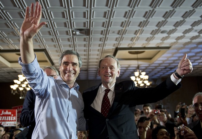 Liberal Leader Michael Ignatieff and former prime minister Jean Chretien take the stage during a rally Wednesday, April 27, 2011 in Toronto. THE CANADIAN PRESS/Paul Chiasson.
