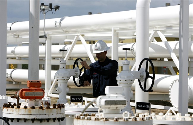 Operations coordinator Doug Rotzien works at the Enbridge Pipelines oil terminal facility in Hardisty, Alta., June 20, 2007. 