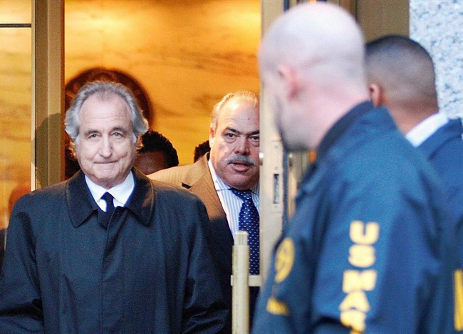 In this Jan. 5, 2009 file photo, Bernard Madoff leaves U.S. District Court in Manhattan after a bail hearing in New York. THE CANADIAN PRESS/AP, Kathy Willens.