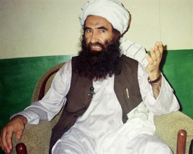FILE - In this Aug. 22, 1998 file photo, Jalaluddin Haqqani, then Taliban Army Supreme Commander, talks to reporters in Miram Shah, Waziristan, Pakistan. After 10 years of bloody battle in Afghanistan, the United States is trolling for Taliban officials to talk peace with before the July drawdown of American troops. (AP Photo/Mohhammad Riaz, File).