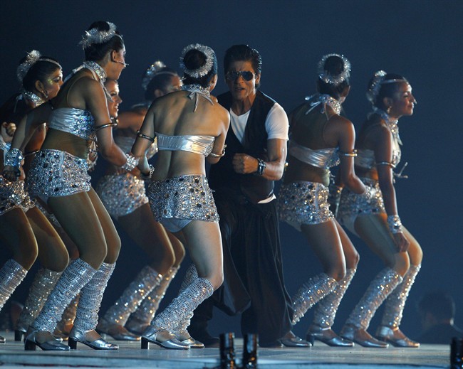 Bollywood actor Shahrukh Khan, center, performs during the opening ceremony of the Indian Premier League (IPL) in Chennai, India, Friday, April 8, 2011. The glitz, the kitsch, and the unfettered fervor of everything Bollywood unfurls in Toronto on Thursday with the arrival of India's cinematic royalty and their bid for a piece of the North American box office. THE CANADIAN PRESS/AP-Aijaz Rahi.