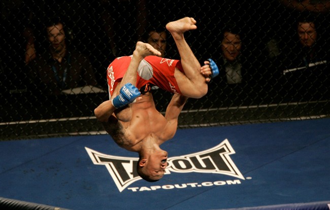 Anthony Pettis celebrates after beating Mike Campbell by submission in the first round of a World Extreme Cagefighting lightweight mixed martial arts fight Sunday, June 7, 2009, in Sacramento, Calif. THE CANADIAN PRESS/AP-Jeff Chiu.
