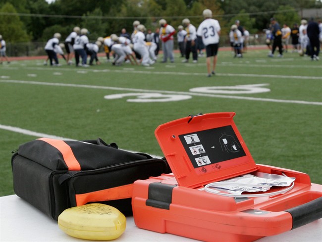 A defibrillator stands ready for use during football practice at Jesuit Preparatory High School in Dallas, Thursday, Oct. 19, 2006.A study finds that more lives will be saved if rescuers reduce the time between chest compressions and delivering a shock to people suffering cardiac arrest. THE CANADIAN PRESS/AP-Ron Heflin.