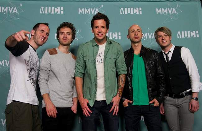 Simple Plan poses at the 2011 MuchMusic Video Awards in Toronto on Sunday, June 19, 2011. When Simple Plan first approached Weezer frontman Rivers Cuomo about writing a song together, the Montreal rockers' motivations weren't purely about crafting a great new tune. THE CANADIAN PRESS/Nathan Denette.