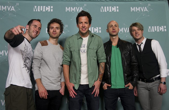 Simple Plan poses at the 2011 MuchMusic Video Awards in Toronto on Sunday, June 19, 2011. When Simple Plan first approached Weezer frontman Rivers Cuomo about writing a song together, the Montreal rockers' motivations weren't purely about crafting a great new tune. THE CANADIAN PRESS/Nathan Denette.