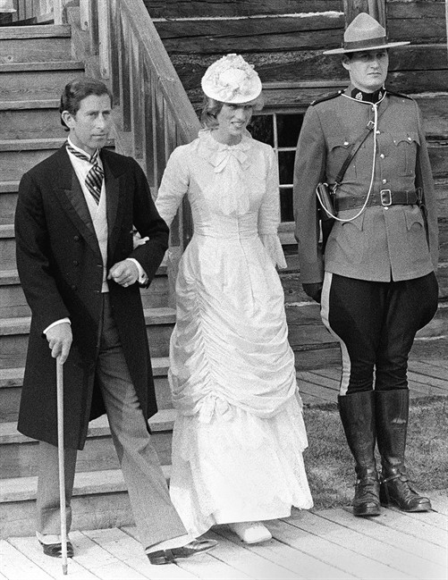 Hordes of people tried to catch a glimpse of Prince Charles and Diana as they embarked on their first tour of Canada in 1983. Prince Charles and Diana, the Princess of Wales, are shown passing by a Mountie as they tour Fort Edmonton Park in period costume June 29, 1983. THE CANADIAN PRESS/Peter Bregg