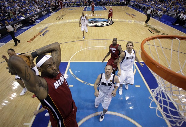 Miami Heat's LeBron James dunks during the second half of Game 3 of the NBA Finals basketball game against the Dallas Mavericks Sunday, June 5, 2011, in Dallas.
