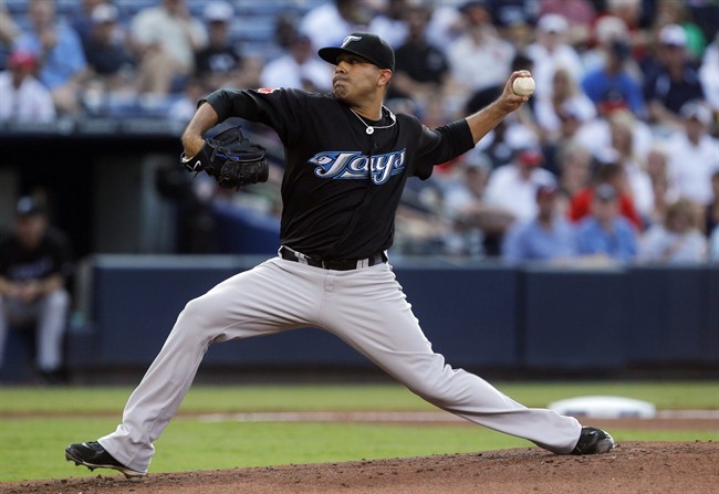 Toronto Blue Jays starting pitcher Ricky Romero works in the first inning of an interleague baseball game against the Atlanta Braves on Monday, June 20, 2011 in Atlanta. (AP Photo/John Bazemore).