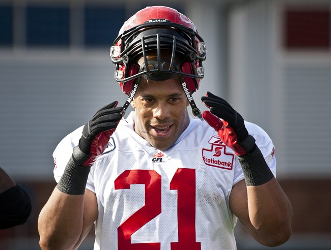 Calgary Stampeders Joffrey Reynolds puts his helmet on during the team's first training camp session in Calgary, Sunday, June 5, 2011. 