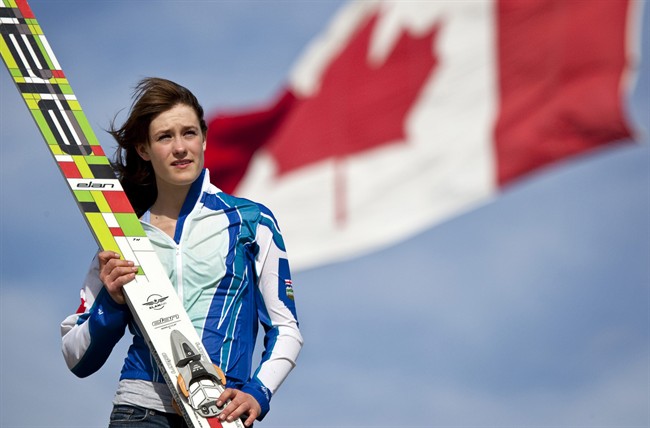 Ski jumper Taylor Heinrich is ecstatic her sport has been recognized by the International Olympic Committee and added to the list of winter sports that compete at an Olympic level. Heinrich stands with her skis at Canada Olympic Park in Calgary, Alta., Thursday, May 12, 2011.THE CANADIAN PRESS/Jeff McIntosh.