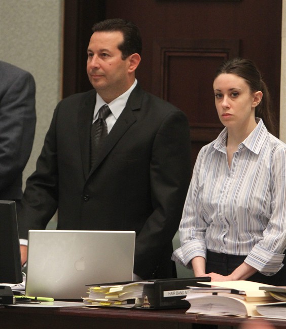 Attorney Jose Baez and his client Casey Anthony stand as the jury enters to courtroom for Anthony's trial at the Orange County Courthouse on Saturday, June 4, 2011 in Orlando, Fla. Anthony, 25, is charged with murder in the 2008 death of her daughter Caylee. If convicted, she could be sentenced to death. (AP Photo/Red Huber, Pool).