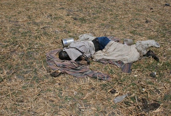 In this photo obtained by the Associated Press on Thursday June 2, 2011 and taken on May 4, 2011, a man, who according U.N. reports had been killed in a apparent massacre of civilians, lies on the ground in the village of Kaldak, Jonglei state, southern Sudan. Southern Sudan soldiers attacking a minority ethnic group targeted and shot unarmed men and women after a battle at this remote Nile River village that resulted in hundreds of civilian victims, according to secret U.N. reports obtained by The Associated Press. The killings including of women and young children, raise serious questions over how much control Southern Sudan's military leaders have over troops in the field as the south approaches its independence day July 9, when it officially breaks away from northern Sudan and becomes the world's newest nation. (AP Photo).