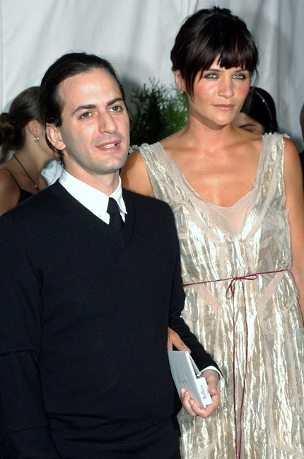 FILE- This Monday, June 3, 2002 file photo shows designer Marc Jacobs, left, and model Helena Christensen as they arrive at the 2002 Council of Fashion Designers of America awards in New York. Jacobs has been selected as this year's lifetime achievement winner by the Council of Fashion Designers of America, a title previously won by Michael Kors, Diane von Furstenberg, Donna Karan, Yves Saint Laurent and Geoffrey Beene, for whom the award is now named. (AP Photo/Suzanne Plunkett, File).
