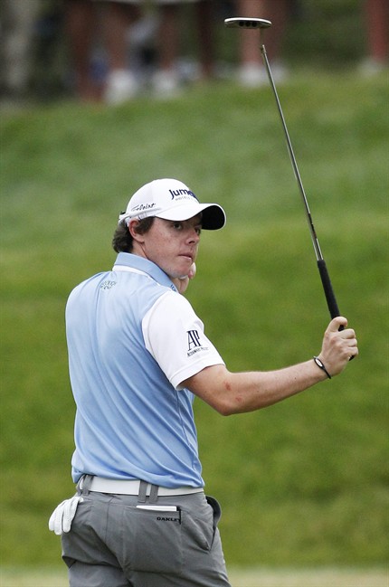 Rory McIlroy, of Northern Ireland, acknowledges the gallery as the walks off the 18th green after the third round of the U.S. Open Championship golf tournament in Bethesda, Md., Saturday, June 18, 2011. (AP Photo/Eric Gay).