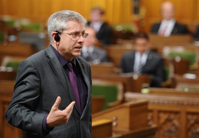 New Democratic Party MP Charlie Angus speaks in the House of Commons as his party continues their filibuster on the government back-to-work legislation on Parliament Hill in Ottawa on Friday, June 24, 2011. THE CANADIAN PRESS/Sean Kilpatrick.