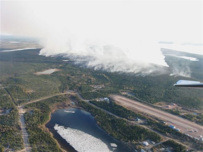 The Wollaston Lake fire is pictured in this aerial handout photo supplied by the Saskatchewan government, Wednesday June 1, 2011. Smoke from a forest fire has closed the only way out for residents of a northern Saskatchewan community who have been told they need to leave. THE CANADIAN PRESS/ HO - Government of Saskatchewan.