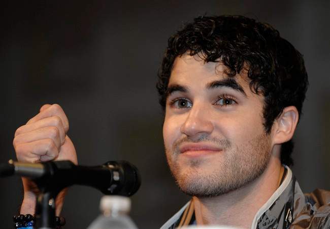 Actor Darren Criss answers a question at a panel for the movie "Glee" at the Comic-Con International 2011 convention held in San Diego Sunday, July 24, 2011. The annual comic book and popular arts convention attracts over 100,000 people and runs through Sunday July 24. (AP Photo/Denis Poroy).