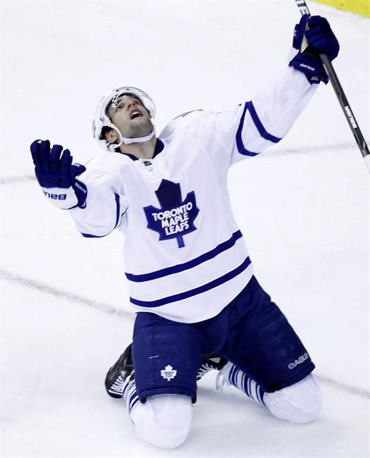 Toronto Maple Leafs' Clarke MacArthur reacts after scoring the tying goal against the Washington Capitals during the third period of an NHL hockey game Monday, Dec. 6, 2010, in Washington. The Leafs have avoided arbitration with MacArthur, re-signing the restricted free agent to a two-year contract extension Tuesday. THE CANADIAN PRESS/AP-Luis M. Alvarez.