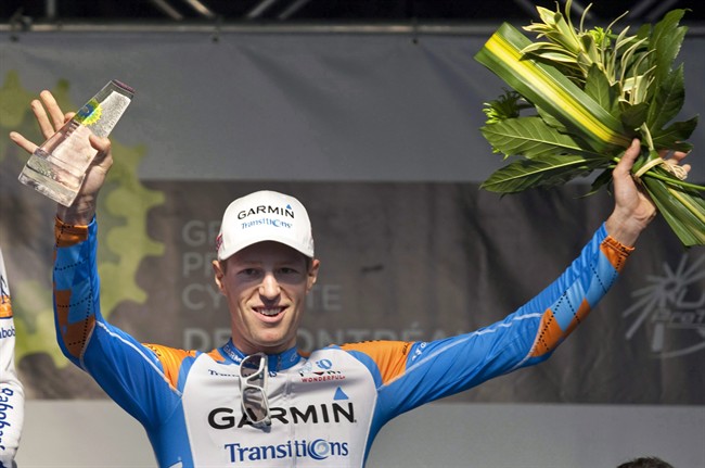 Canadian Ryder Hesjedal celebrates his third place finish on September 12, 2010 in Montreal. Hesjedal is nursing sore ribs, back and neck. But he's grateful he's made it through the first nine stages of the Tour de France. THE CANADIAN PRESS/Paul Chiasson.