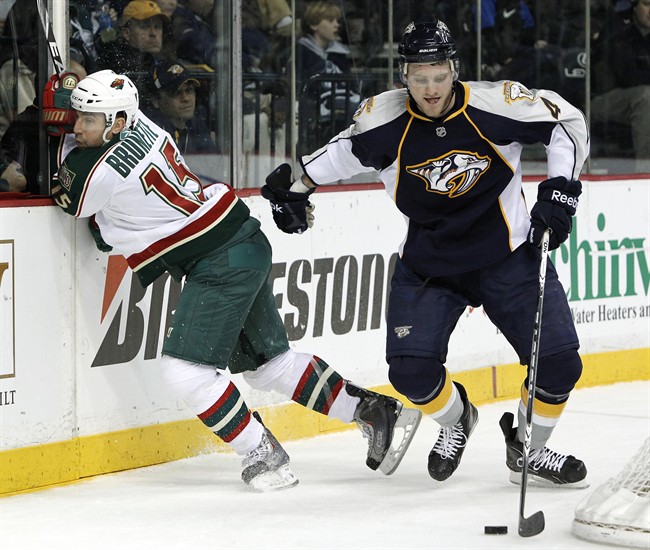 Nashville Predators defenseman Cody Franson, right, takes the puck away from Minnesota Wild left wing Andrew Brunette (15) in the second period of an NHL hockey game on Thursday, March 10, 2011, in Nashville, Tenn. The Toronto Maple Leafs acquired Matthew Lombardi and Franson from the Nashville Predators on Sunday. THE CANADIAN PRESS/AP-Mark Humphrey.