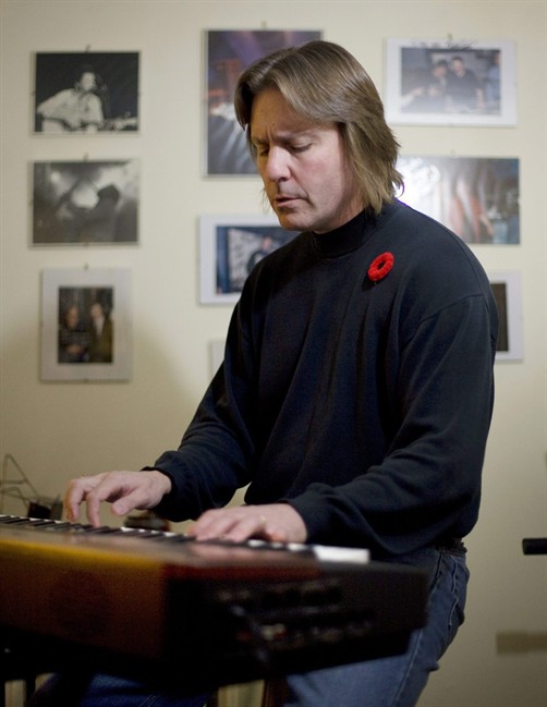 Bob Reid plays the keyboard in the basement of his Toronto home Sunday, November 8, 2009. As Canadian troops were preparing to exit the battlefields of Kandahar, Toronto songwriter Bob Reid was readying a cordial reception. He has just released “Soldier, Welcome Home,” his second single honouring the Canadian Forces in Afghanistan, after 2009's “Highway of Heroes.” THE CANADIAN PRESS/Darren Calabrese.