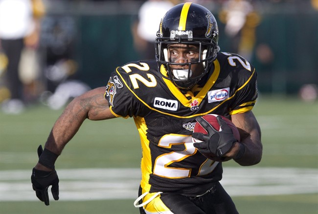 Hamilton Tiger-Cats' Avon Cobourne runs the ball during first half CFL football action against the Winnipeg Blue Bombers in Hamilton, Ont. Friday, July 1, 2011.