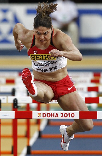 Canada's Priscilla Lopes-Schliep clear a hurdle in a semi final of the Women's 60m hurdles at the 13th IAAF World Indoor Athletics Championships in Saturday, March 13, 2010 in Doha, Qatar. Seven months pregnant with a baby girl, and a year out from the 2012 London Summer Games, the Olympic podium is exactly where the Canadian hurdling star plans to be at this time next year. THE CANADIAN PRESS/ AP - Hassan Ammar.