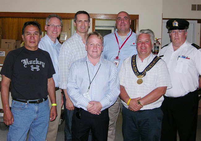 Harry Meekis (Sandy Lake Community Leader), Hon. John Wilkinson (MPP Perth-Wellington), Hon. Dalton McGuinty (Premier of Ontario), County of Wellington Warden Chris White, John Saunders (Director of Disaster Management and International Response for the Canadian Red Cross), Wellington North Mayor Ray Tout and Drew Maddison (Emergency Management Ontario Field Officer), left to right, in Arthur, Ont., on Tuesday July 26, 2011. McGuinty also met with 204 evacuees from Sandy Lake. THE CANADIAN PRESS/ HO- Wellington County.