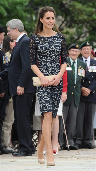 The Duchess of Cambridge takes part in a ceremony at the National War Memorial in Ottawa on Thursday, June 30, 2011. Whether stepping out in a sleek dress and heels or going casual with skinny jeans and slingbacks, Kate left a fashionable imprint throughout the Canadian tour with looks from both sides of the Atlantic highlighting her signature style. THE CANADIAN PRESS/Sean Kilpatrick.