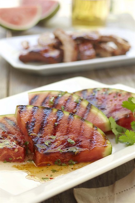 Transform watermelon from sweet to savoury with this mouth watering Thai-inspired sauce. Watermelon wedges are grilled until caramelized, drizzled with garlic chili sauce and garnished with cilantro. Serve as a side dish along with ribs, chicken or shrimp. THE CANADIAN PRESS/HO-National Watermelon Promotion Board-Geoff George.
