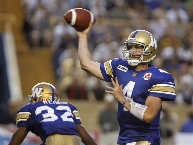 Winnipeg Blue Bombers' Buck Pierce looks to pass in the second half CFL action against the Toronto Argonauts in Winnipeg Friday July 8, 2011. THE CANADIAN PRESS/Trevor Hagan.