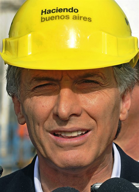 In this picture taken June 9, 2011, Buenos Aires' Mayor Mauricio Macri unveils a water pipe in Buenos Aires, Argentina. Sunday's mayoral election in Argentina's capital pits a hand-picked supporter of President Cristina Fernandez against her leading opponent, Mauricio Macri, in a test case for her own reelection hopes in October. (AP Photo/Rodolfo Pezzoni, DyN).