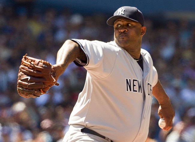 New York Yankees starting pitcher CC Sabathia pitches during 8th inning AL action against the Toronto Blue Jays in Toronto on Saturday July 16, 2011. THE CANADIAN PRESS/Frank Gunn.